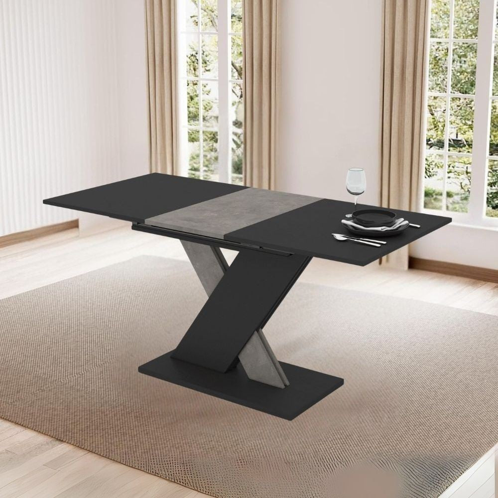 ego-arredo-tavolo-allungabile-axi-in-colore-nero-con-dettaglio-gamba-e-allunga-in-cemento